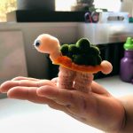 Easy Pom Pom Pom Craft for Kids - Turtle - finished being held by kid