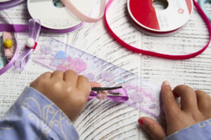 make diy bow hair clip - step 11 - wrap short ribbon around hair clip